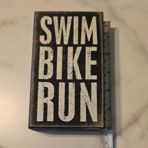 Swim Bike Run wooded sign